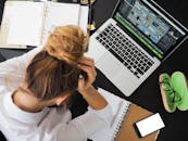 Woman Sitting in Front of Macbook