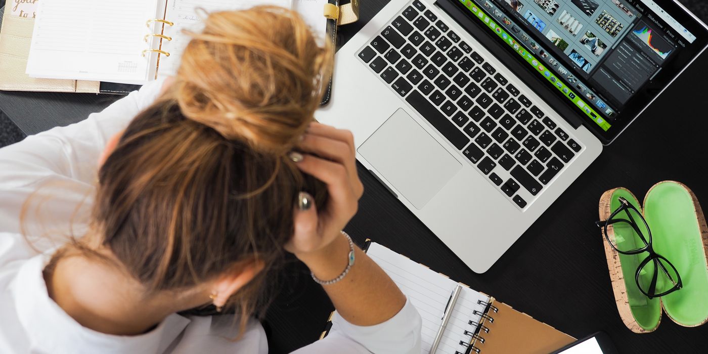 Person on laptop researching hotel rates