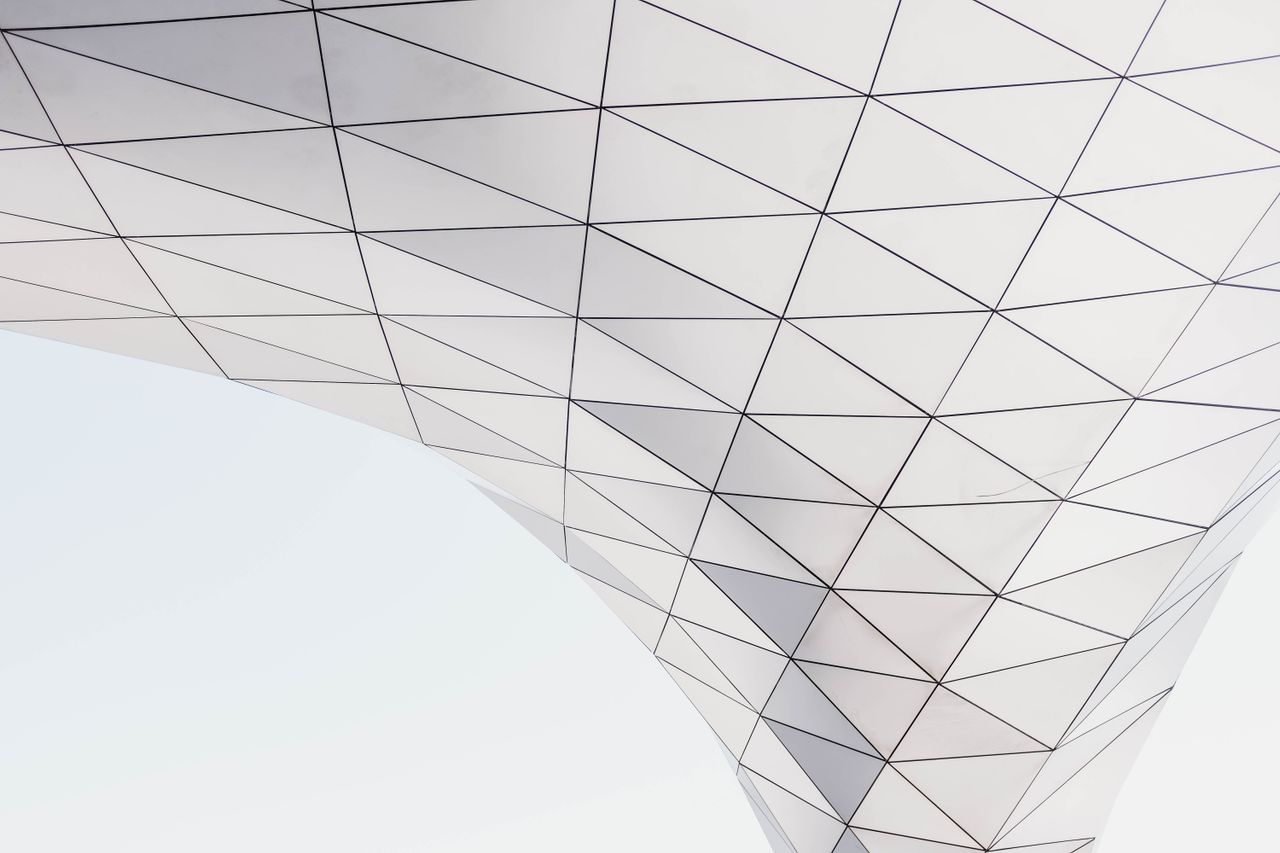 low angle view of a modern geometric architectural structure with tria