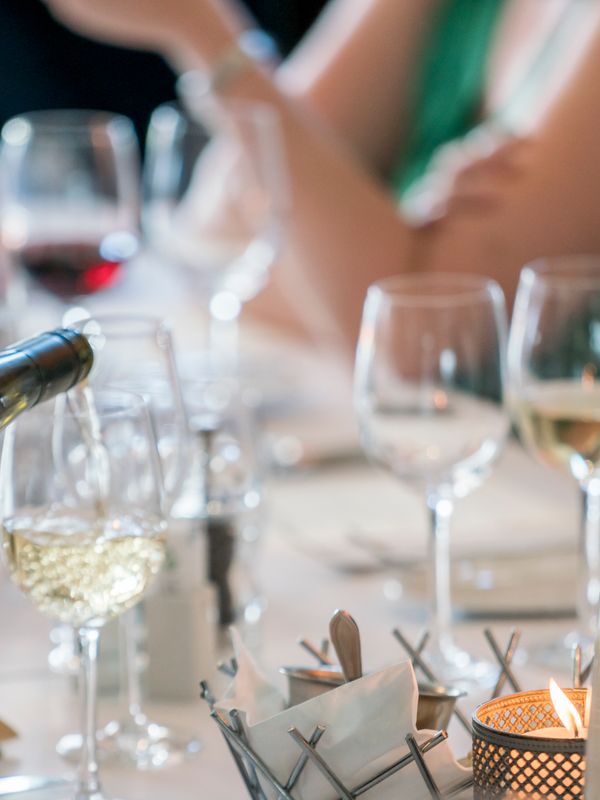 Red wine being poured at the table