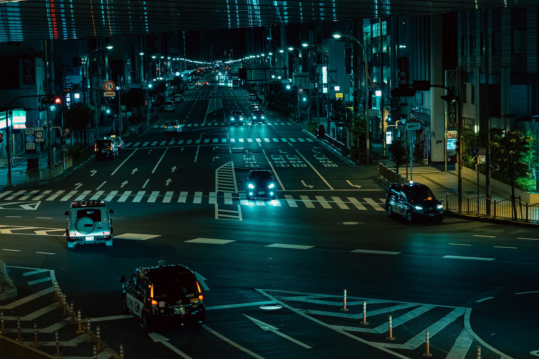 Captivating night scene of Tokyo's bustling streets with vibrant city lights.