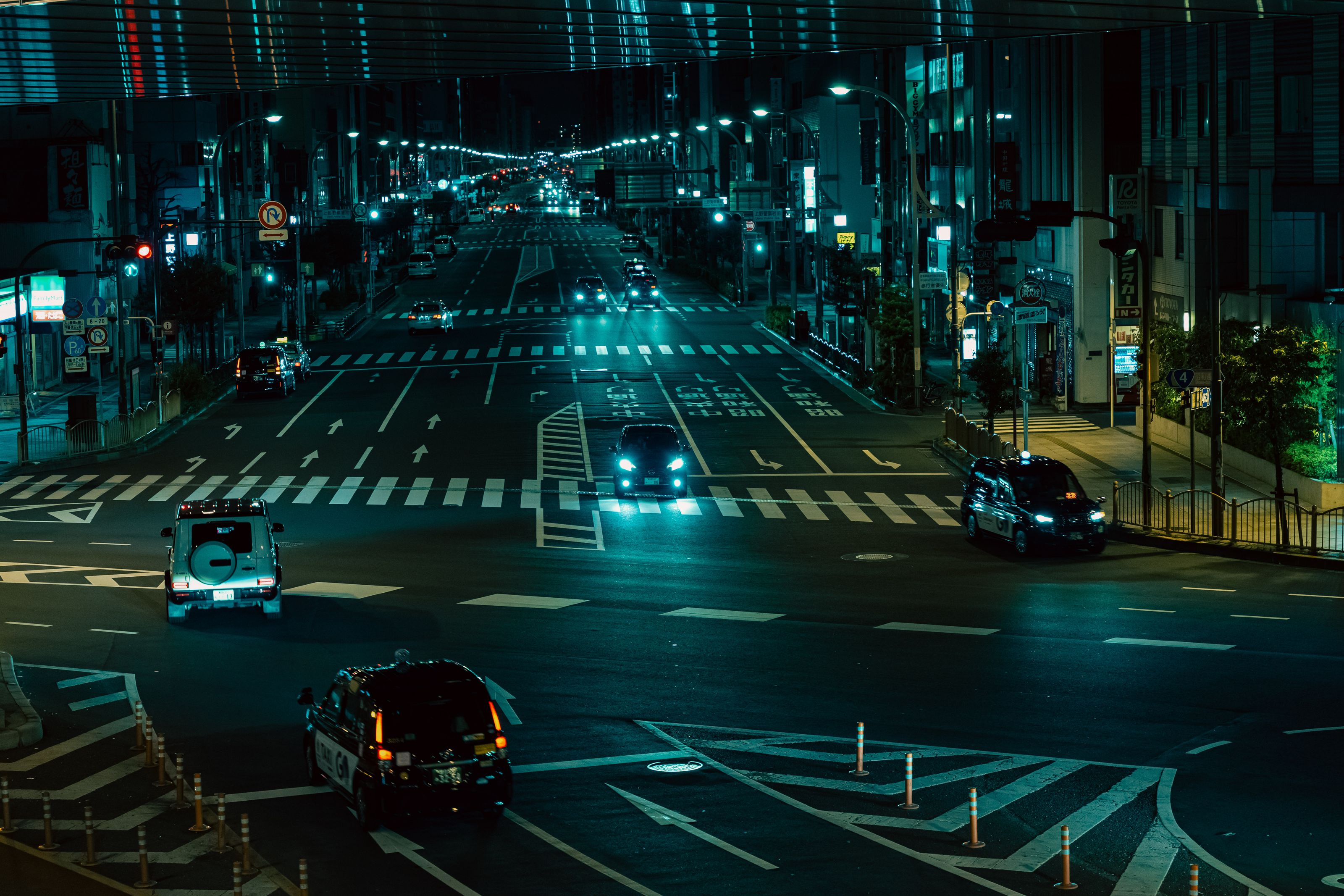Captivating night scene of Tokyo's bustling streets with vibrant city lights.