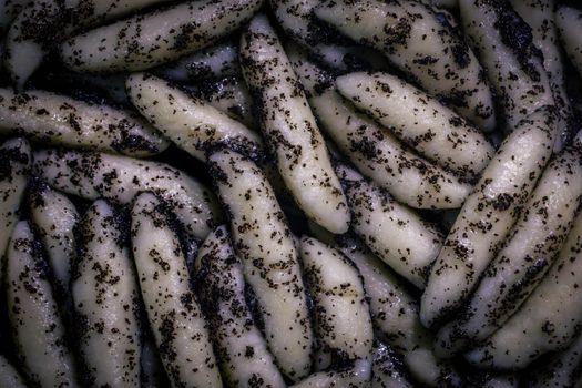 Detailed close-up of Austrian Mohnnudeln, showcasing traditional poppy seed dessert texture.