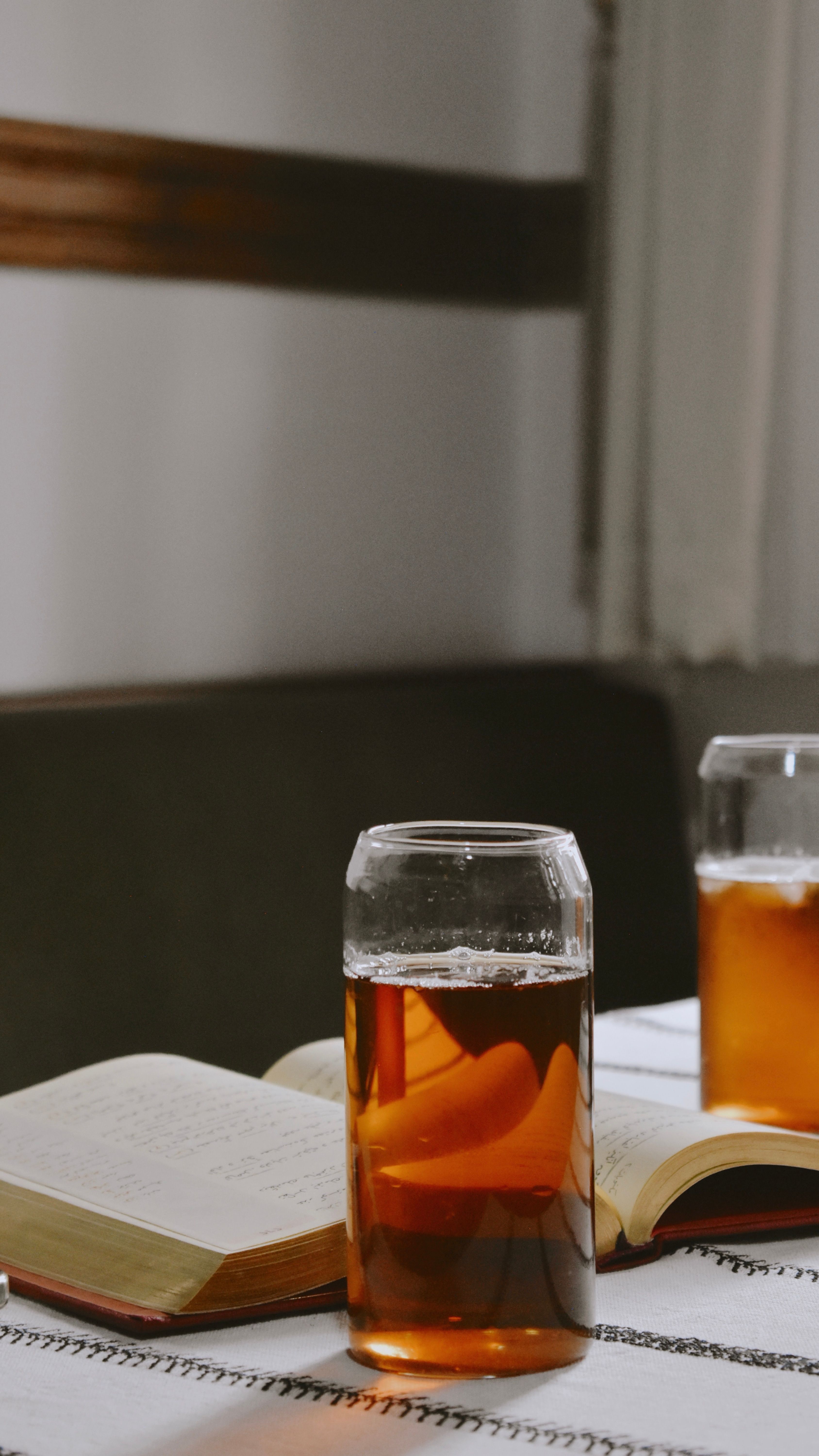Cozy Indoor Scene with Iced Tea and Open Books · Free Stock Photo
