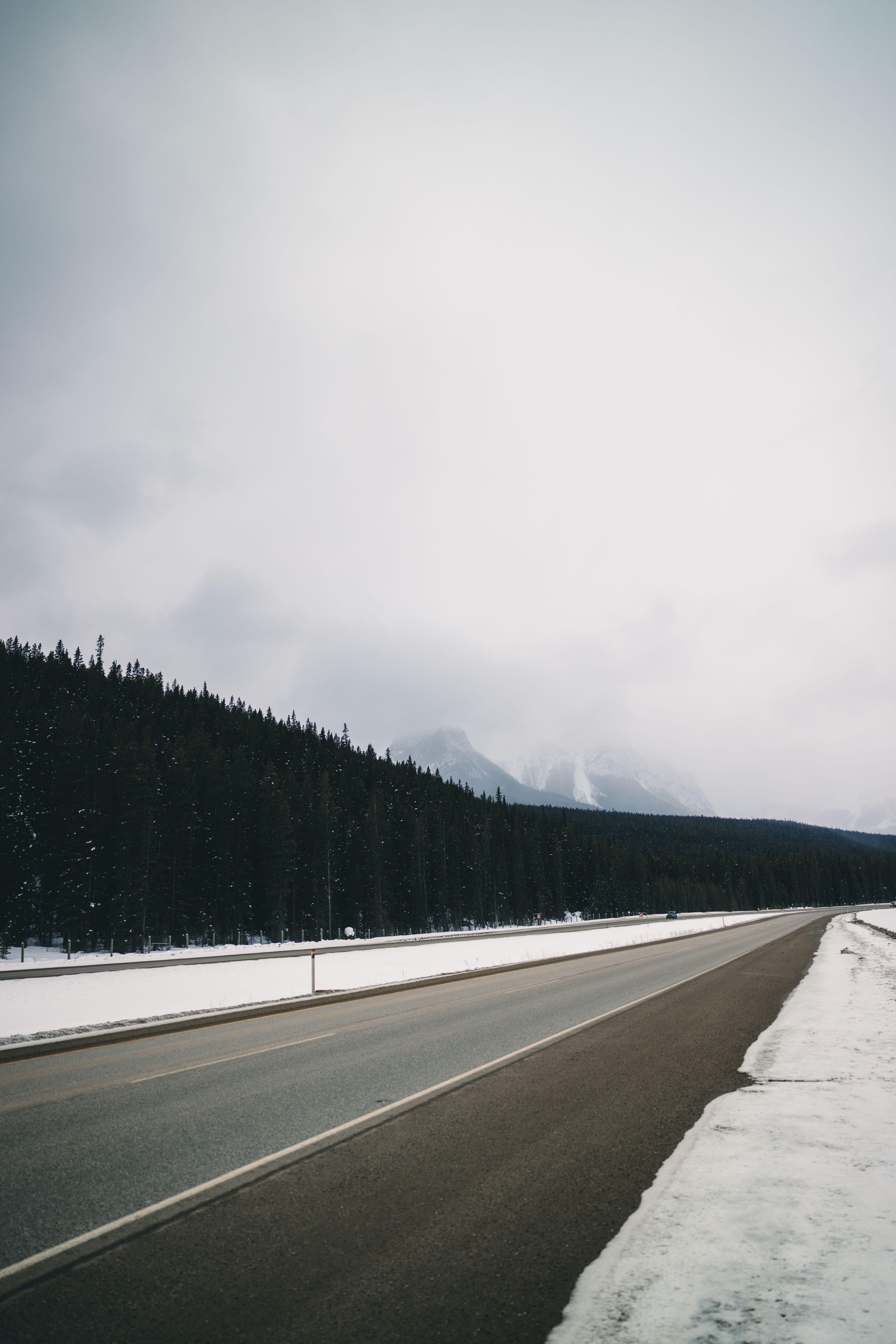 Scenic Winter Road through Canadian Wilderness · Free Stock Photo