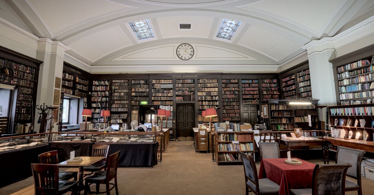 Explore the elegant and historic interior of a classic library in Manchester, England. Perfect for literature enthusiasts.