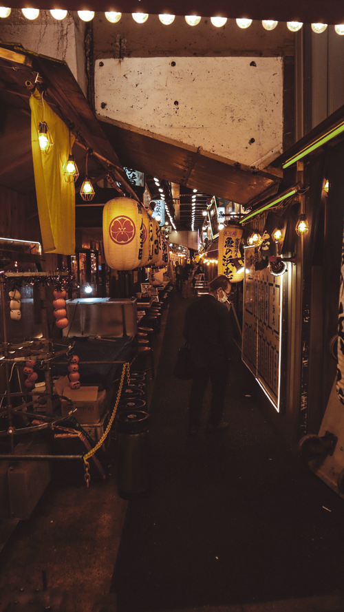 Free Explore the bustling night markets of Tokyo showcasing vibrant street food culture and traditional Japanese lanterns. Stock Photo