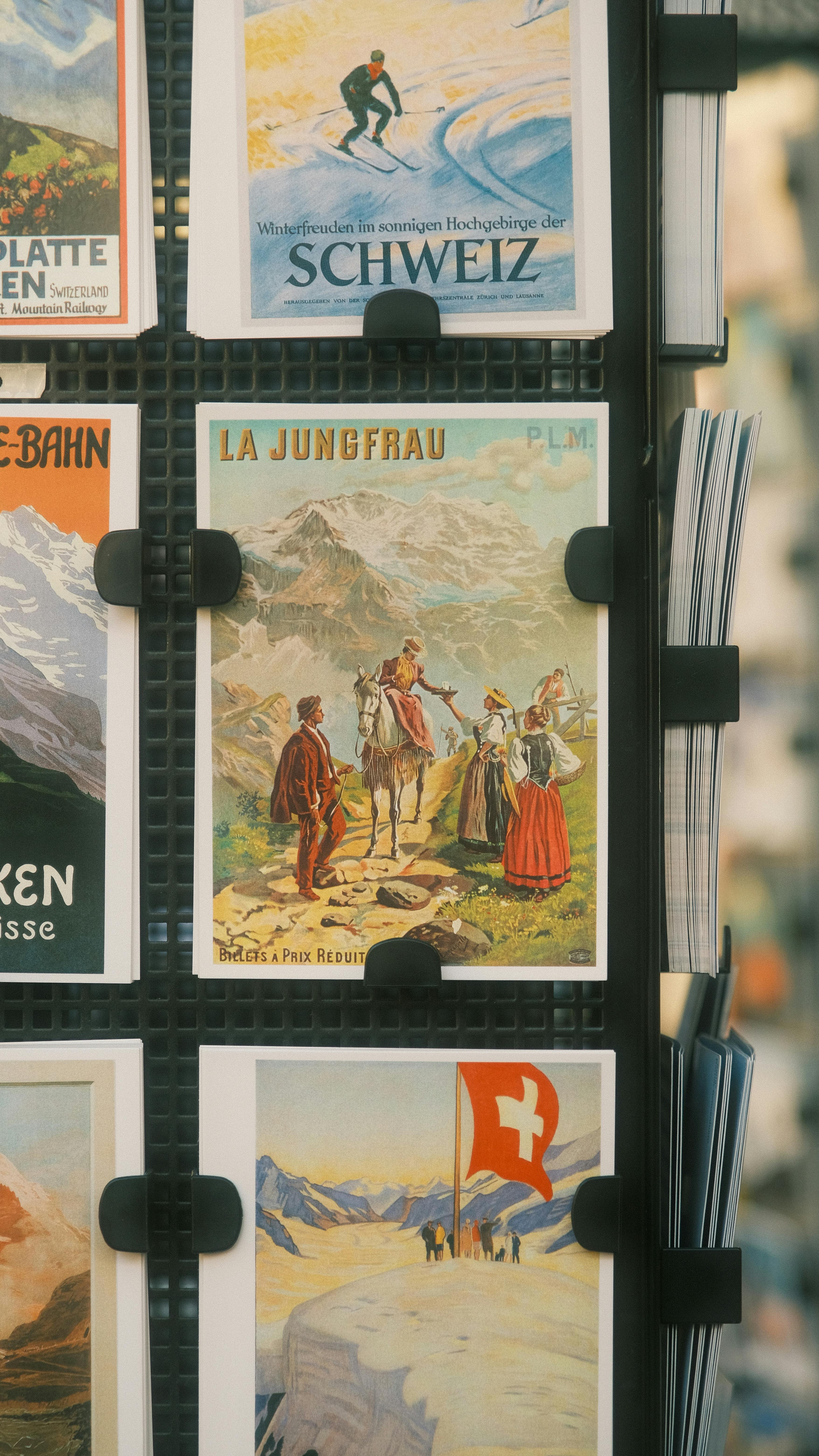 A collection of vintage Swiss travel posters showcasing iconic locations and Alpine scenes.