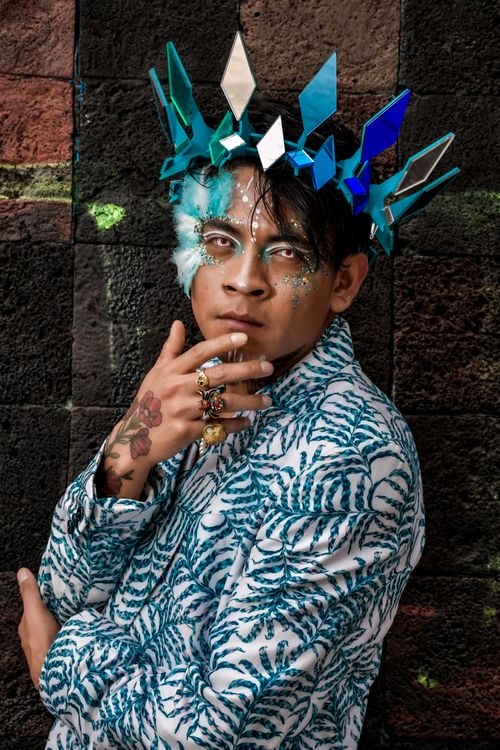Free Creative portrait of a person wearing geometric crown and artistic makeup. Stock Photo