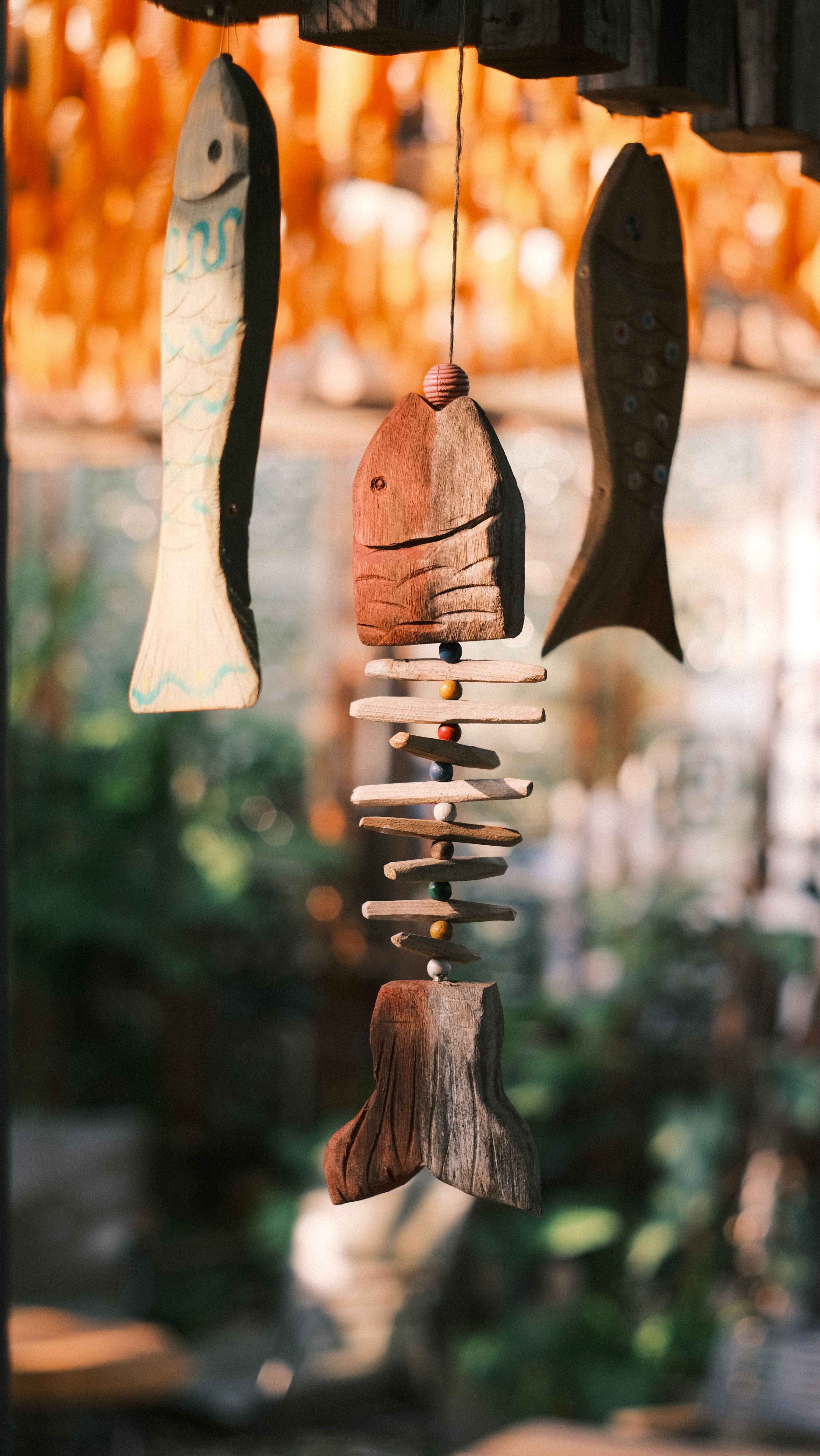 Rustic Wooden Fish Mobile Hanging Outdoors · Free Stock Photo