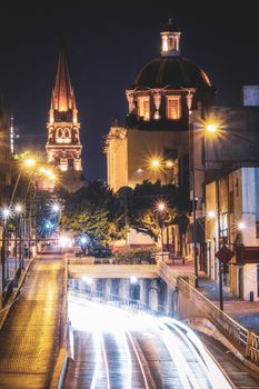 Stunning night view of the illuminated Guadalajara Cathedral with light trails.