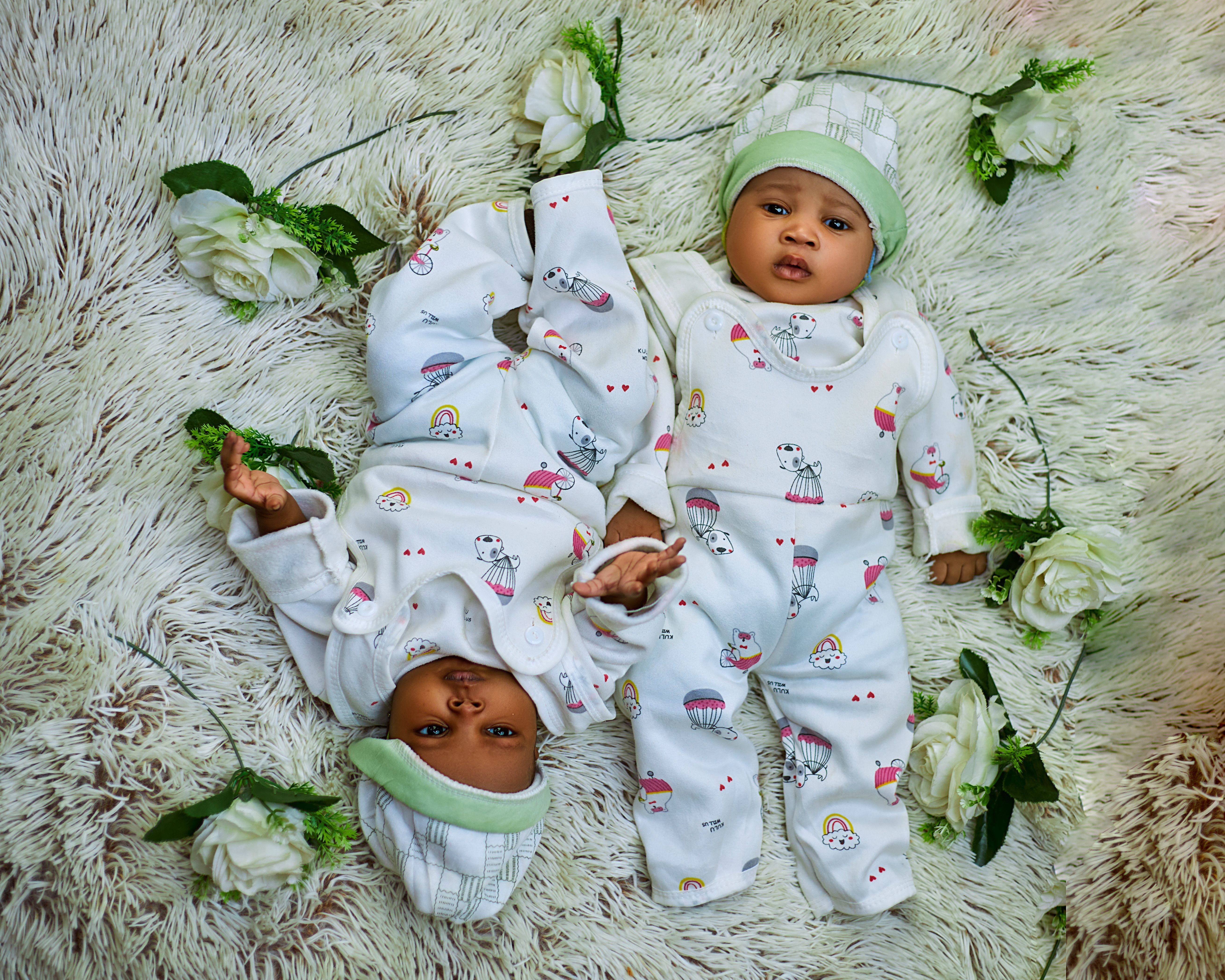 Adorable Babies in Matching Outfits on Plush Rug · Free Stock Photo