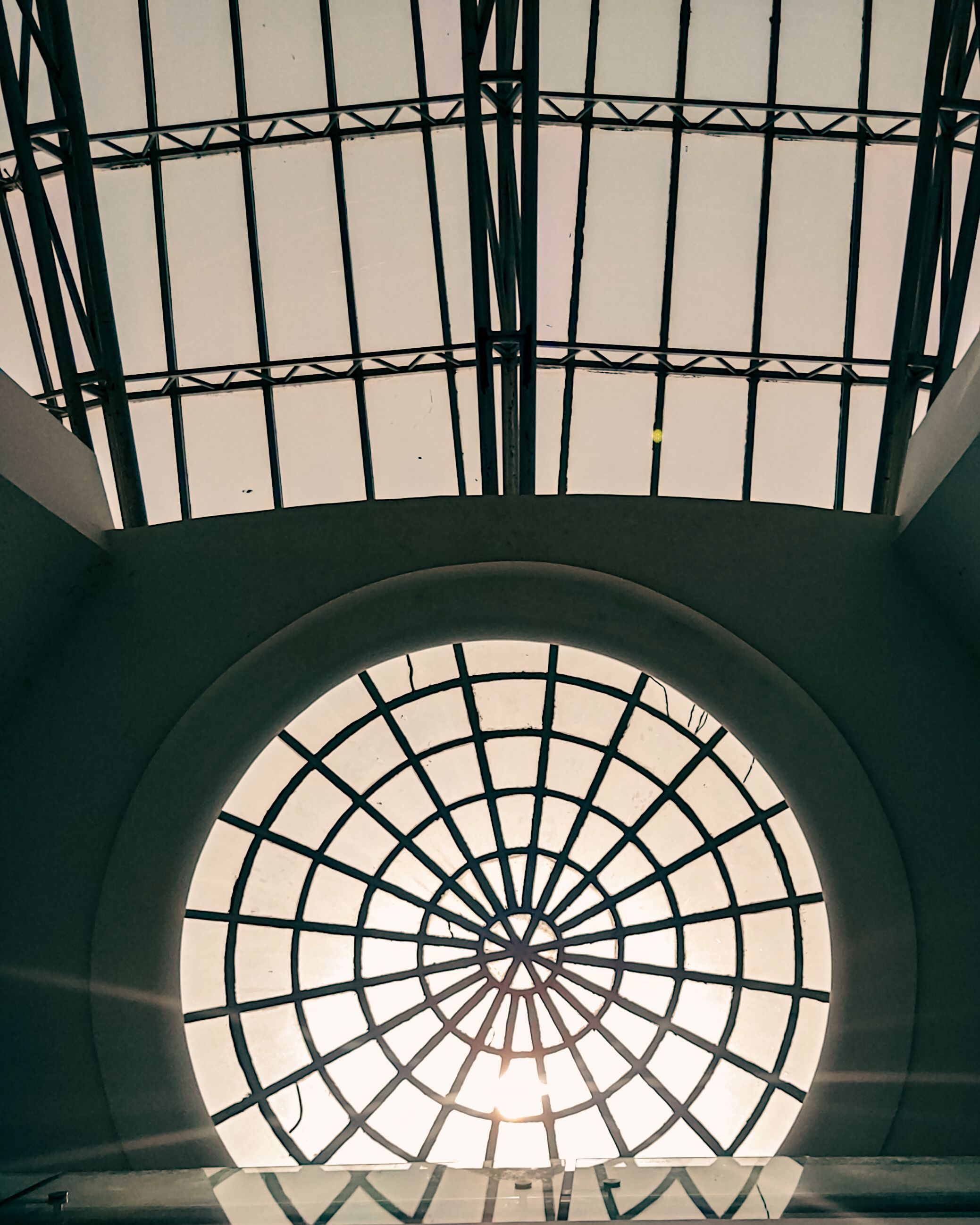 Symmetrical view of a geometric dome skylight showcasing modern architectural design elements.