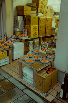 Colorful fruit stall in a Japanese market showcasing fresh produce and local culture.