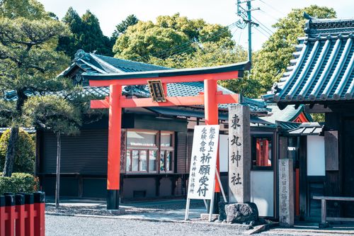 Free Beautiful torii gate entrance to a shrine in Kyoto, Japan, surrounded by lush greenery. Stock Photo