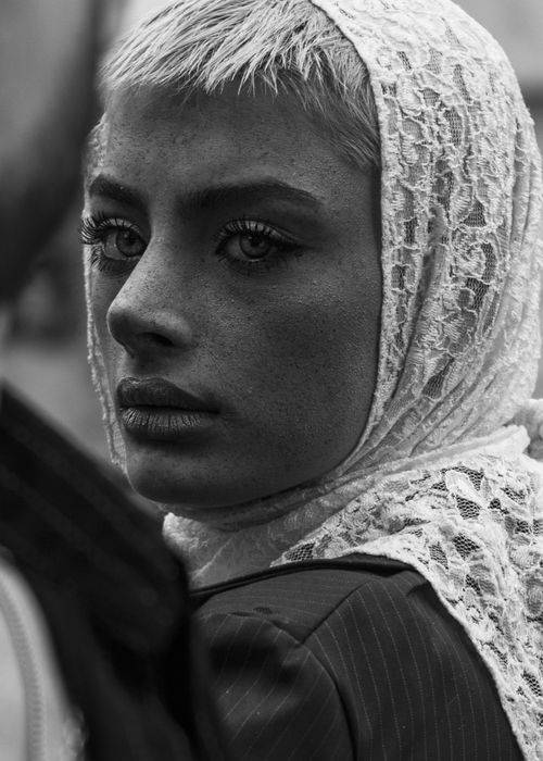Free Dramatic black and white portrait of a woman wearing a lace headscarf, conveying a moody atmosphere. Stock Photo