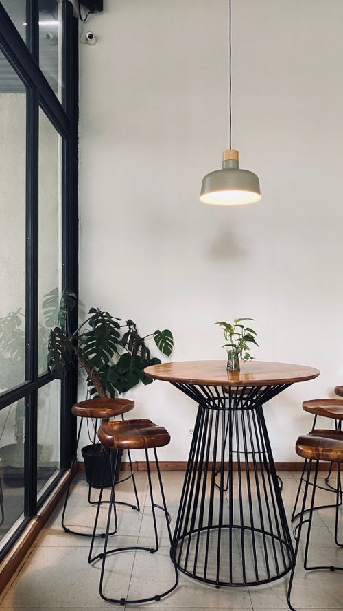 Free Stylish minimalist cafe interior with wooden furnishings in Malang, Indonesia. Stock Photo