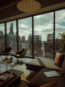 Cozy lounge with a view of the Chicago cityscape, featuring skyscrapers and iconic architecture.