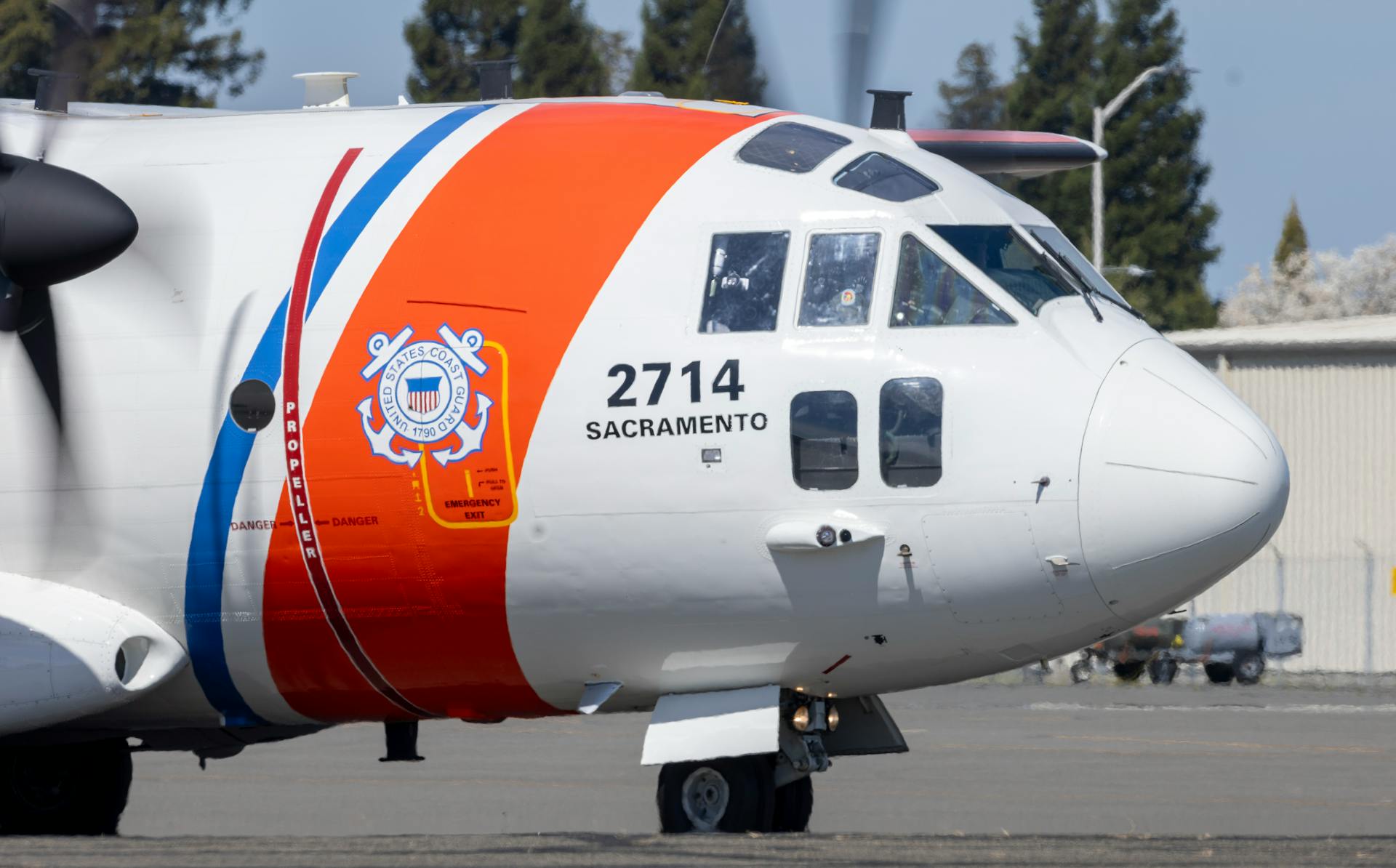 Close-up of US Coast Guard aircraft at Sacramento with clear Coast Guard logo.