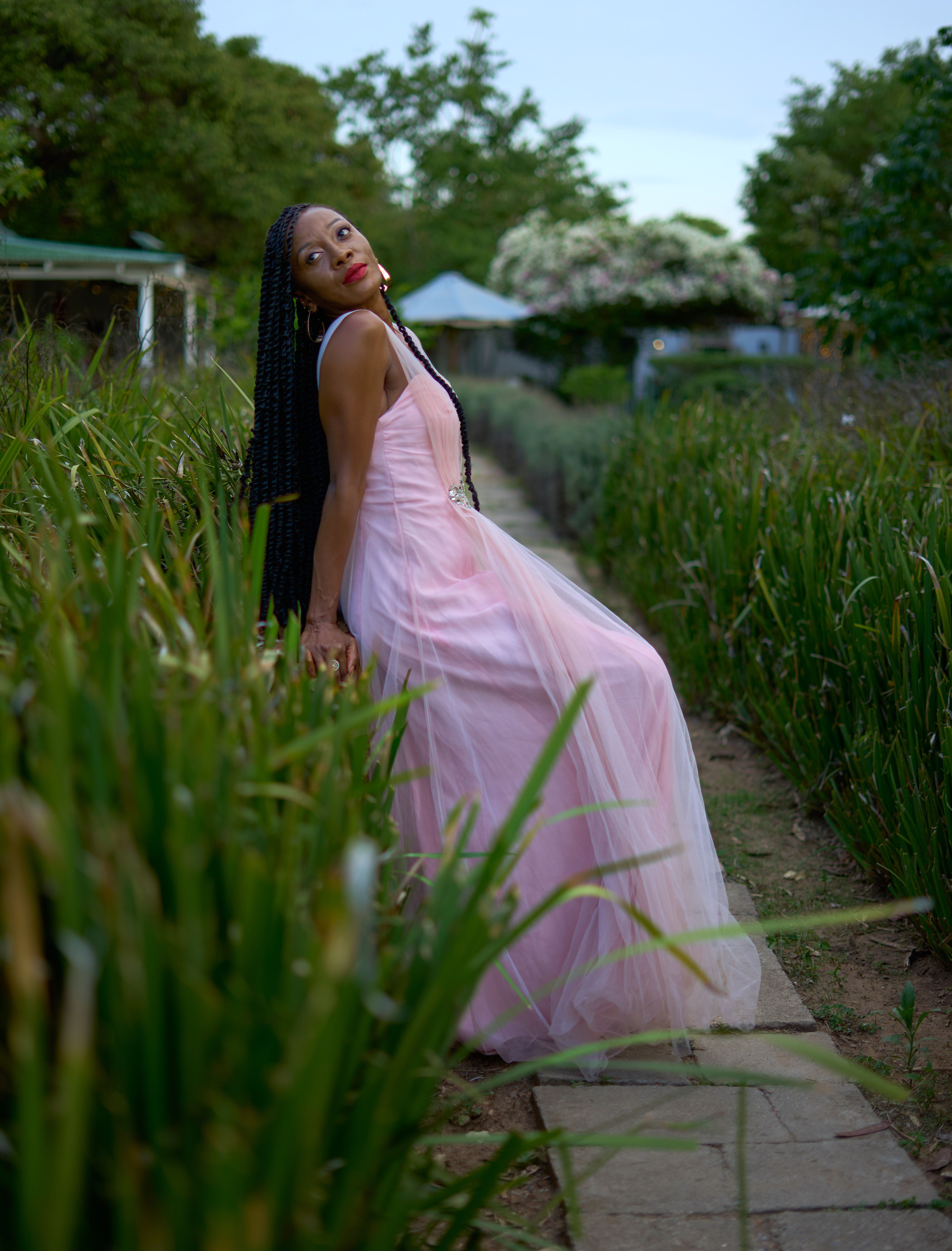 Elegant Outdoor Portrait of Woman in Pink Dress · Free Stock Photo