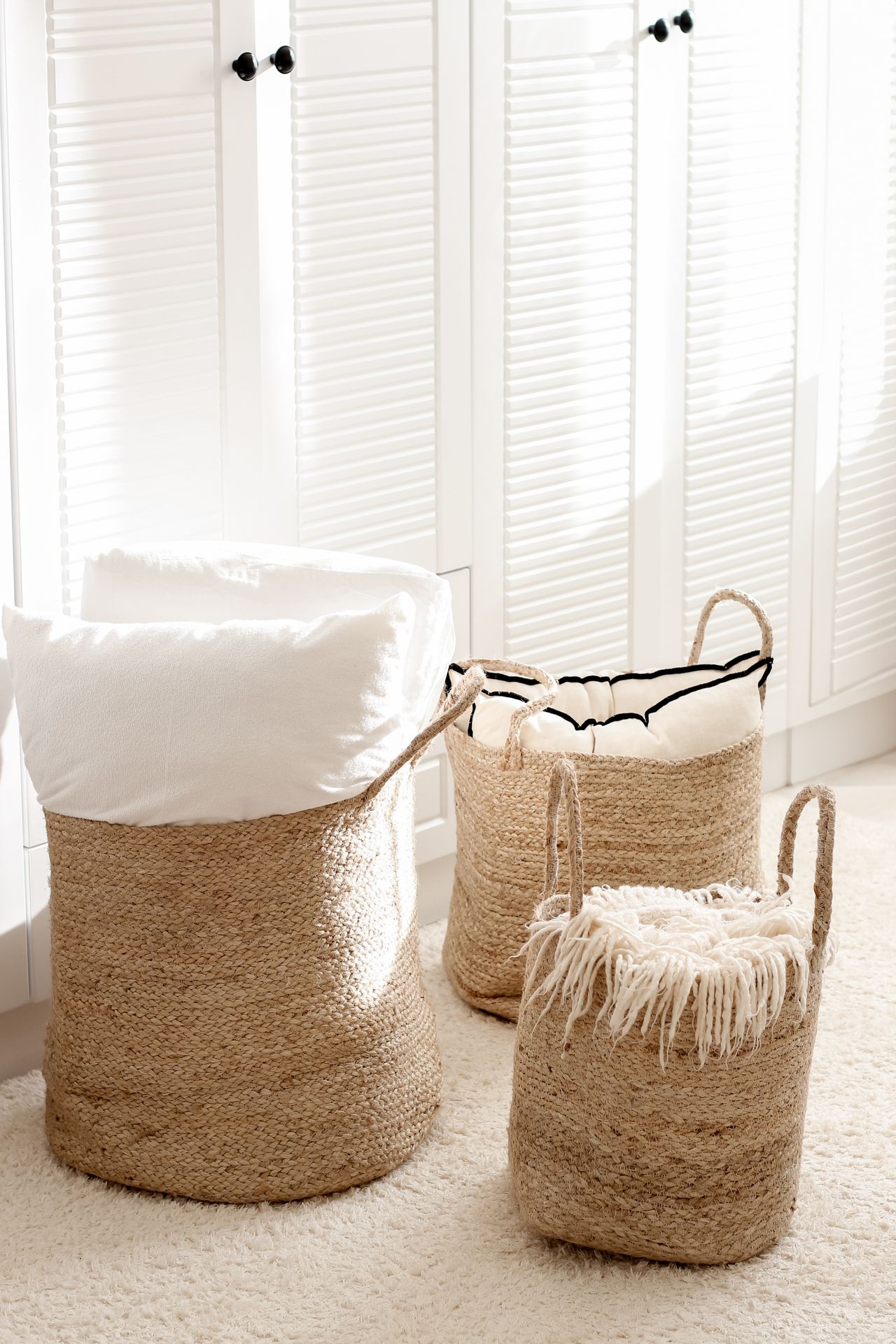 Wicker baskets used as storage in a bright modern interior Wicker baskets used as storage in a bright modern interior
