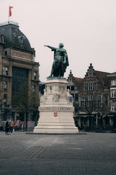 Captivating view of a historic statue in Ghent, showcasing classic Flemish architecture.
