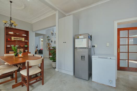 Bright and airy dining area with wooden furniture and elegant decor.