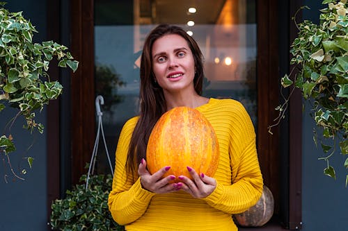 Woman Holding Pumpkin
