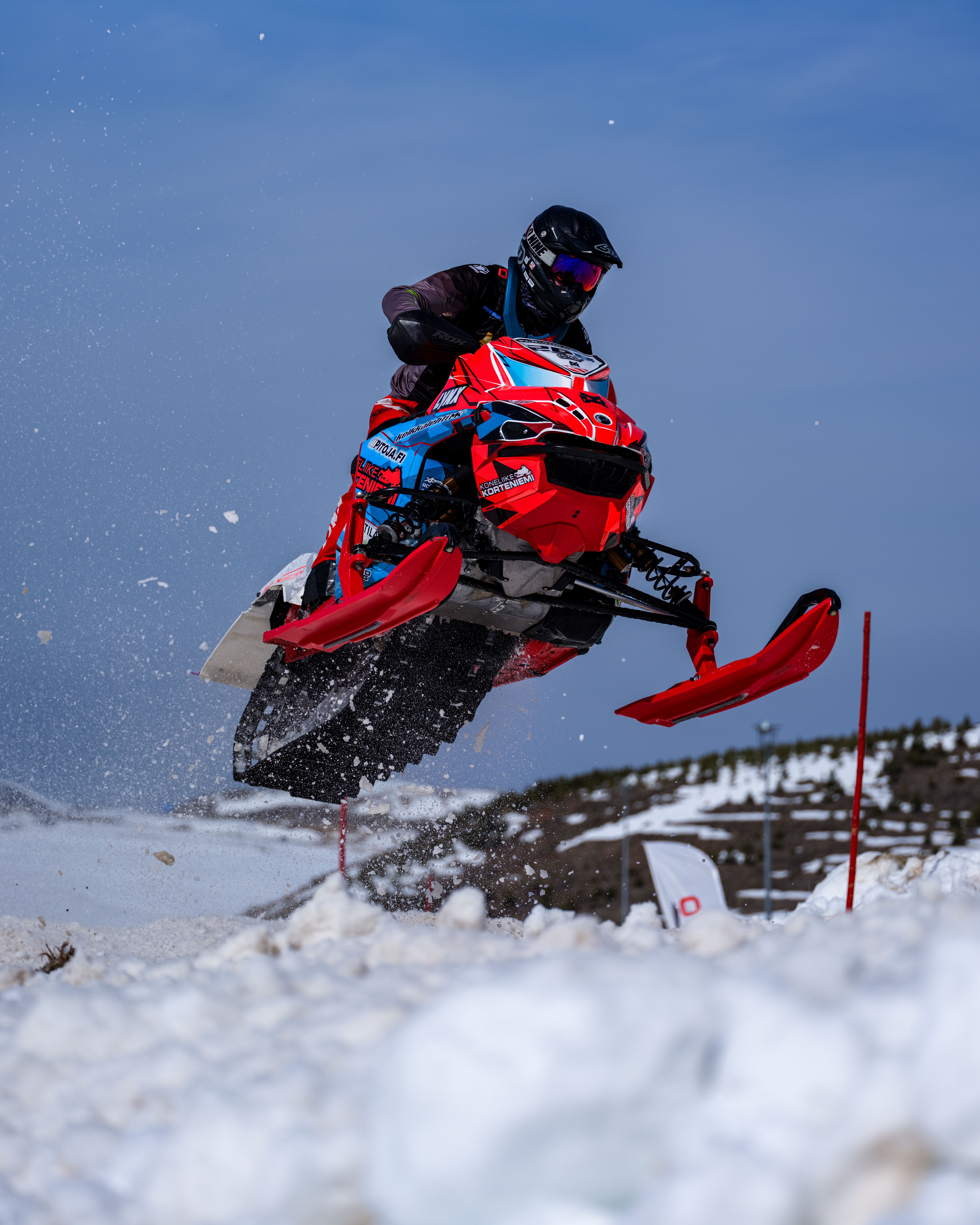 Dynamic Snowmobile Jump in Winter Landscape · Free Stock Photo