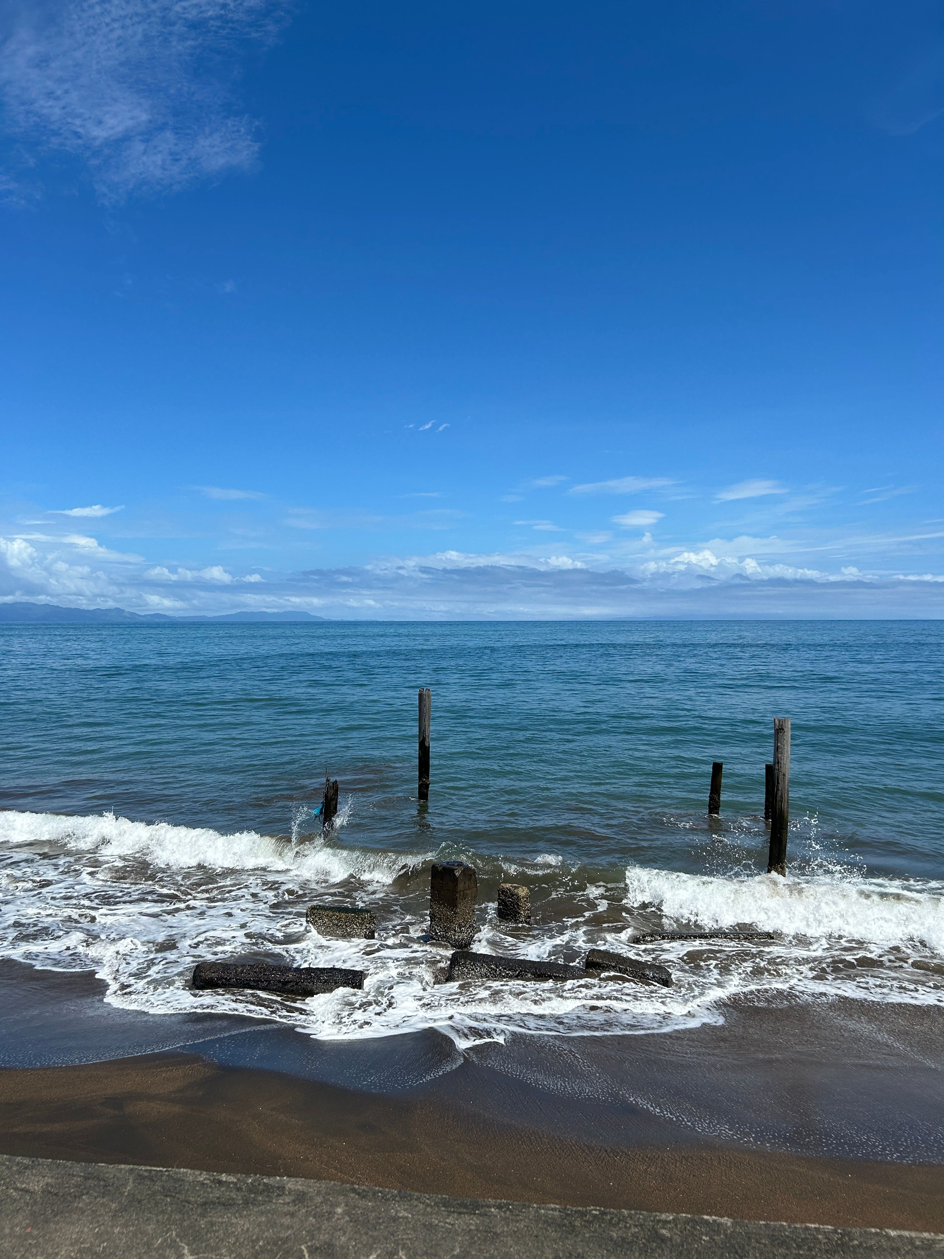 Peaceful seaside landscape with blue skies in Tiwi, Bicol, Philippines.