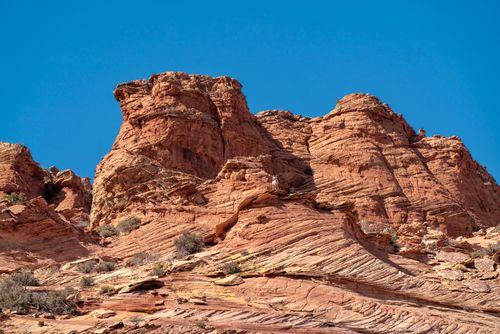 Free Stunning red rock landscape with vibrant blue sky, showcasing natural beauty and geological wonder. Stock Photo