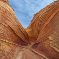 Banded sandstone canyon walls carved into smooth waves. Photo by Rob Annen on Pexels