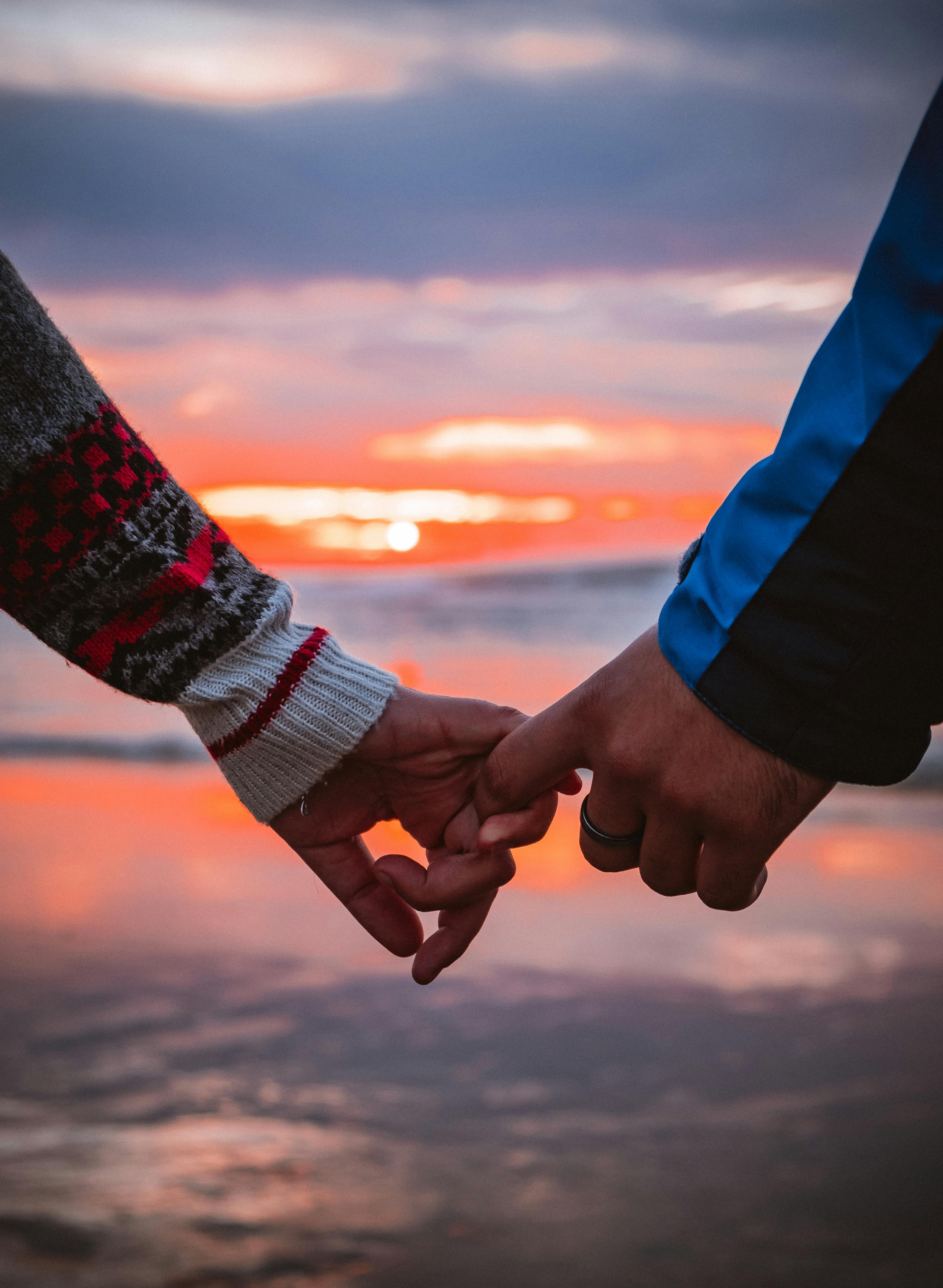 A couple in love in the field on beautiful sky background. Profile