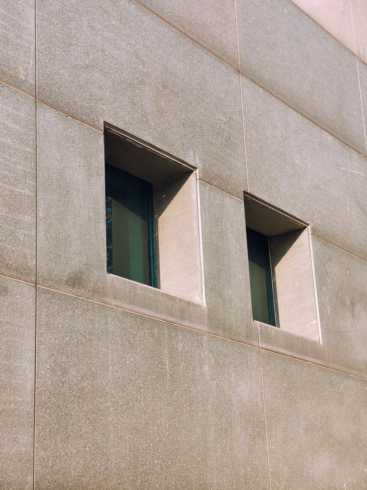 Minimalist modern architecture with deep-set windows