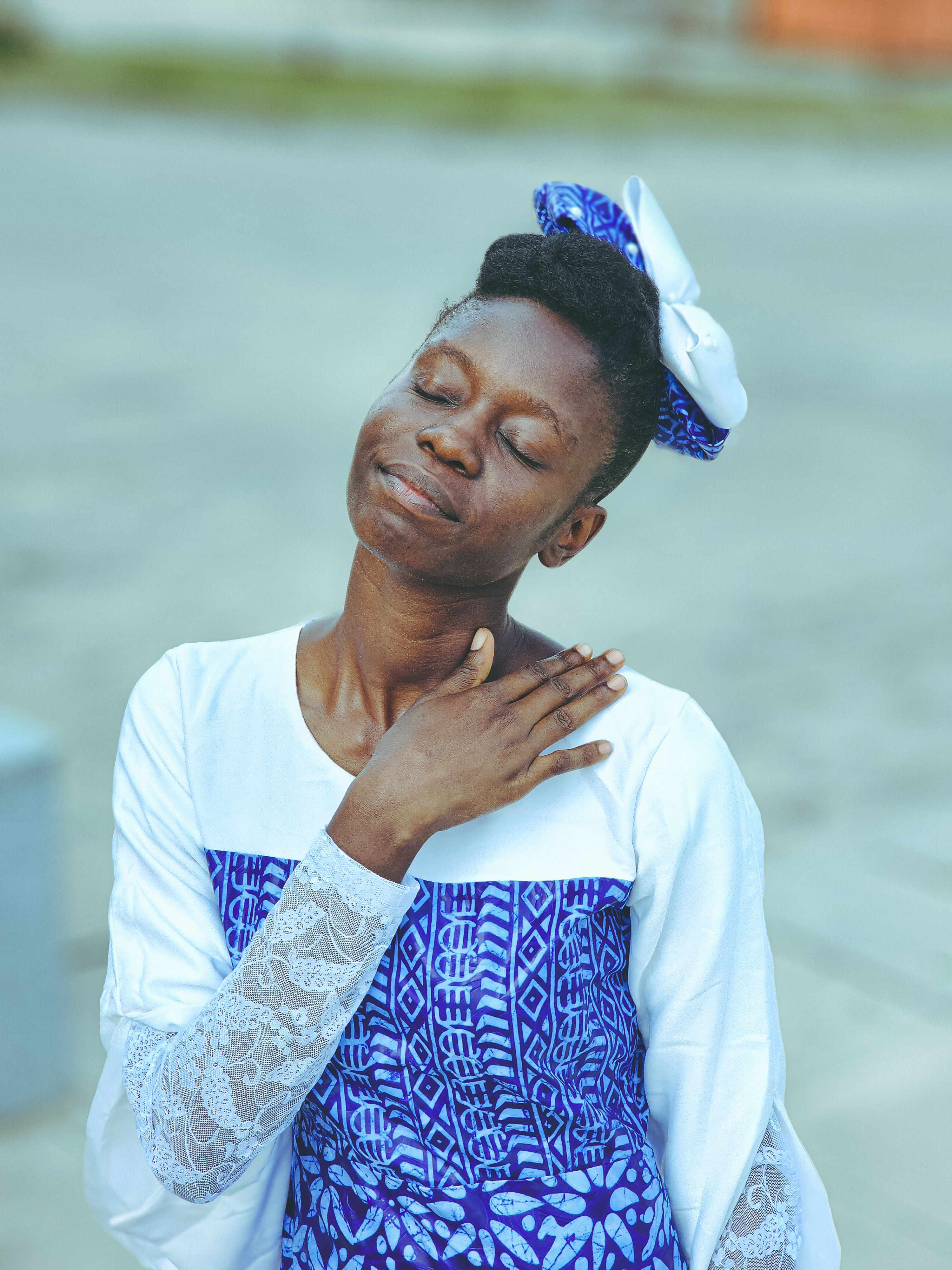 Serene Woman in Blue Traditional Attire Outdoors · Free Stock Photo