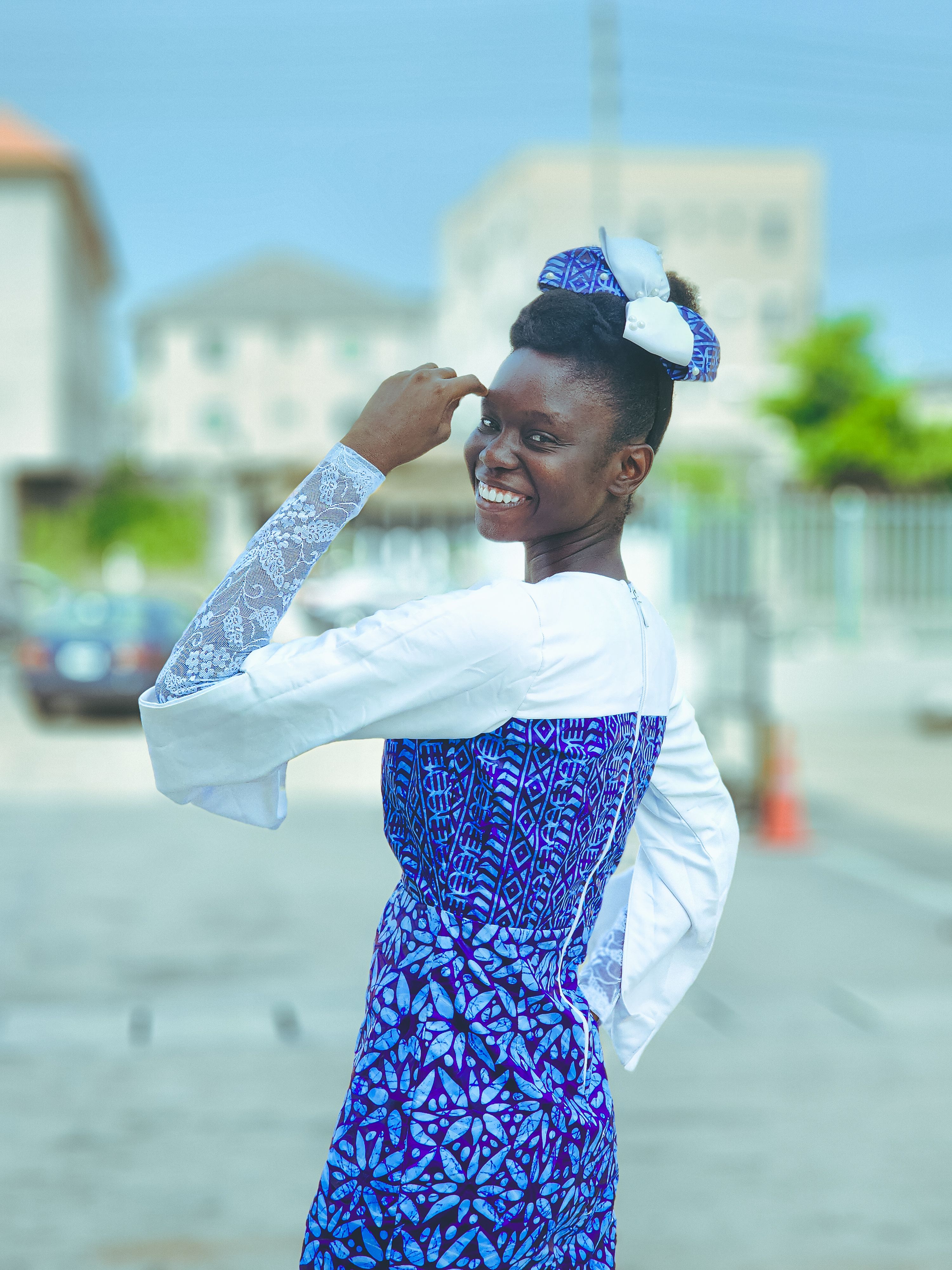 Smiling Woman in Blue and White Traditional Dress · Free Stock Photo