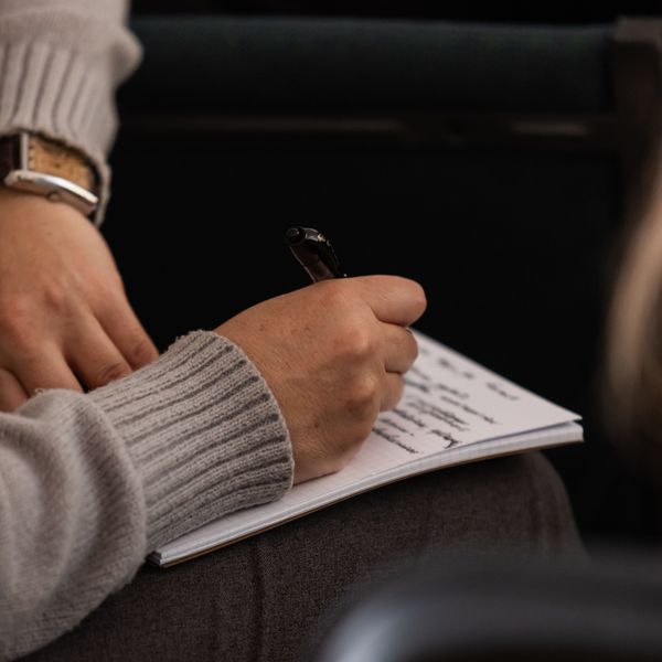 Notes taken in a notebook during the kickoff sync — photo by Biekir Litovchenko on Pexels