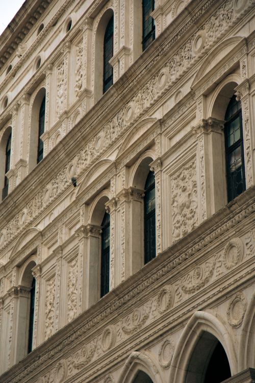 Free Detailed view of a historic Gothic architecture facade in Venice, showcasing ornate designs and craftsmanship. Stock Photo
