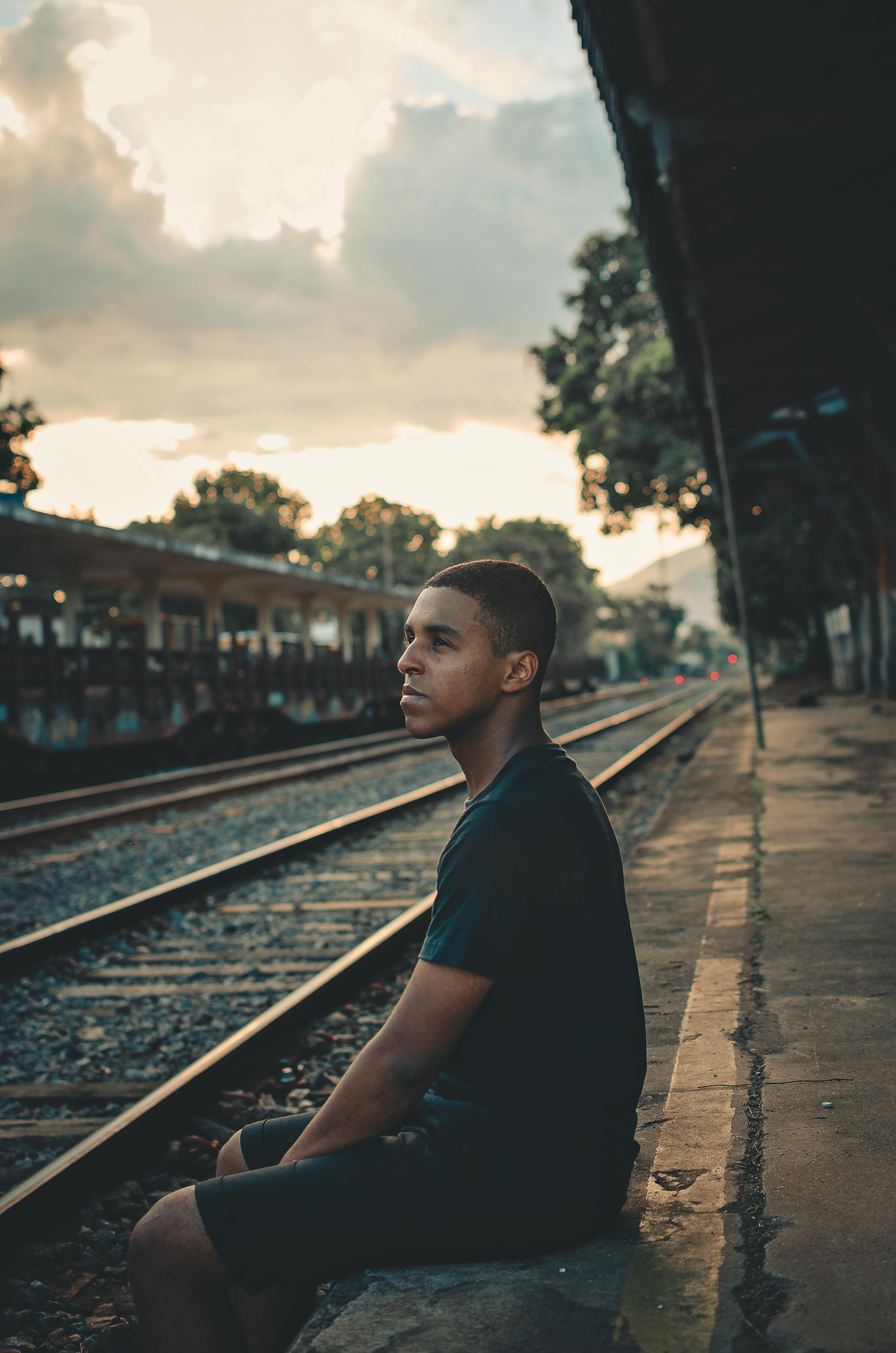 Boy posing near railway track - PixaHive