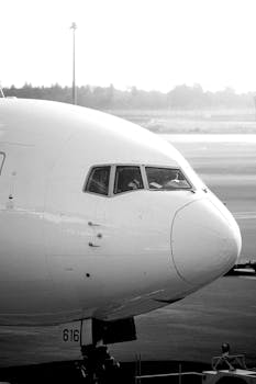 Black and white photo of airplane cockpit at Ota City airport, Tokyo, Japan.