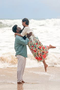 A loving couple shares a moment by the seaside, embracing with joy and affection.