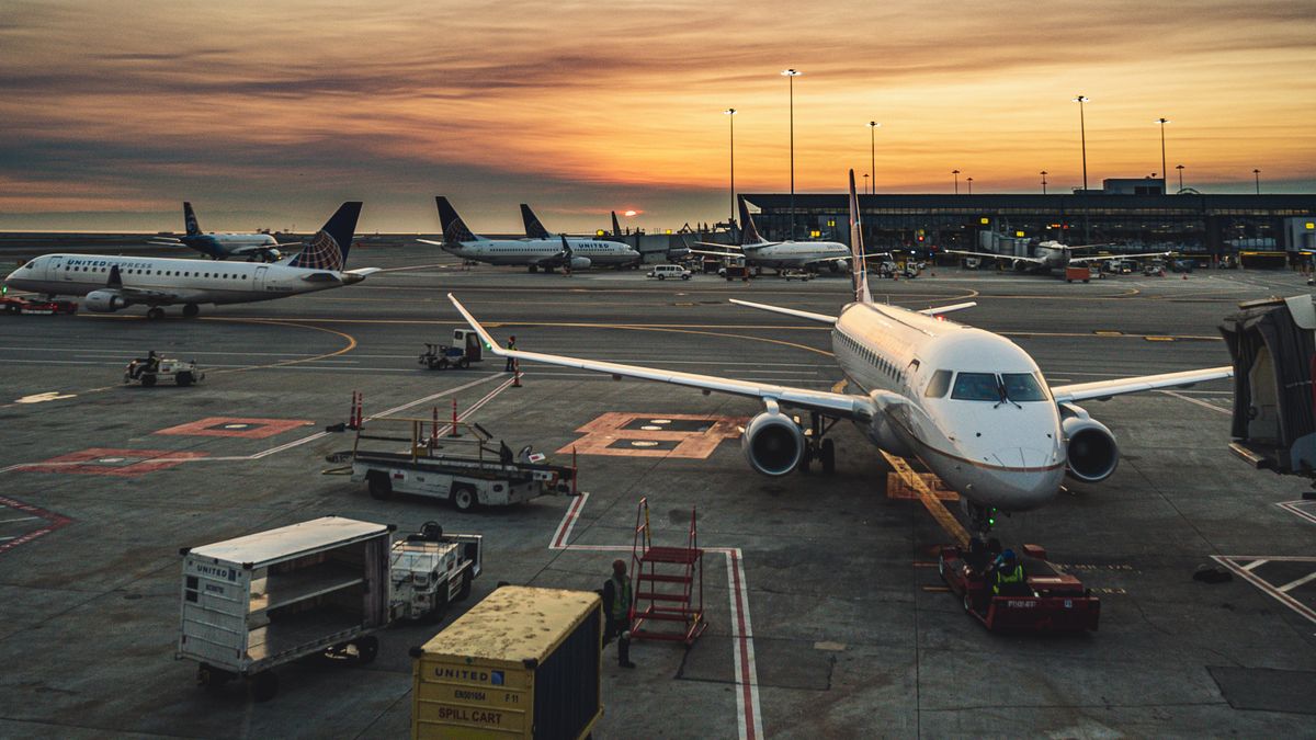 Busy airport terminal with travelers during record Memorial Day 2026 weekend