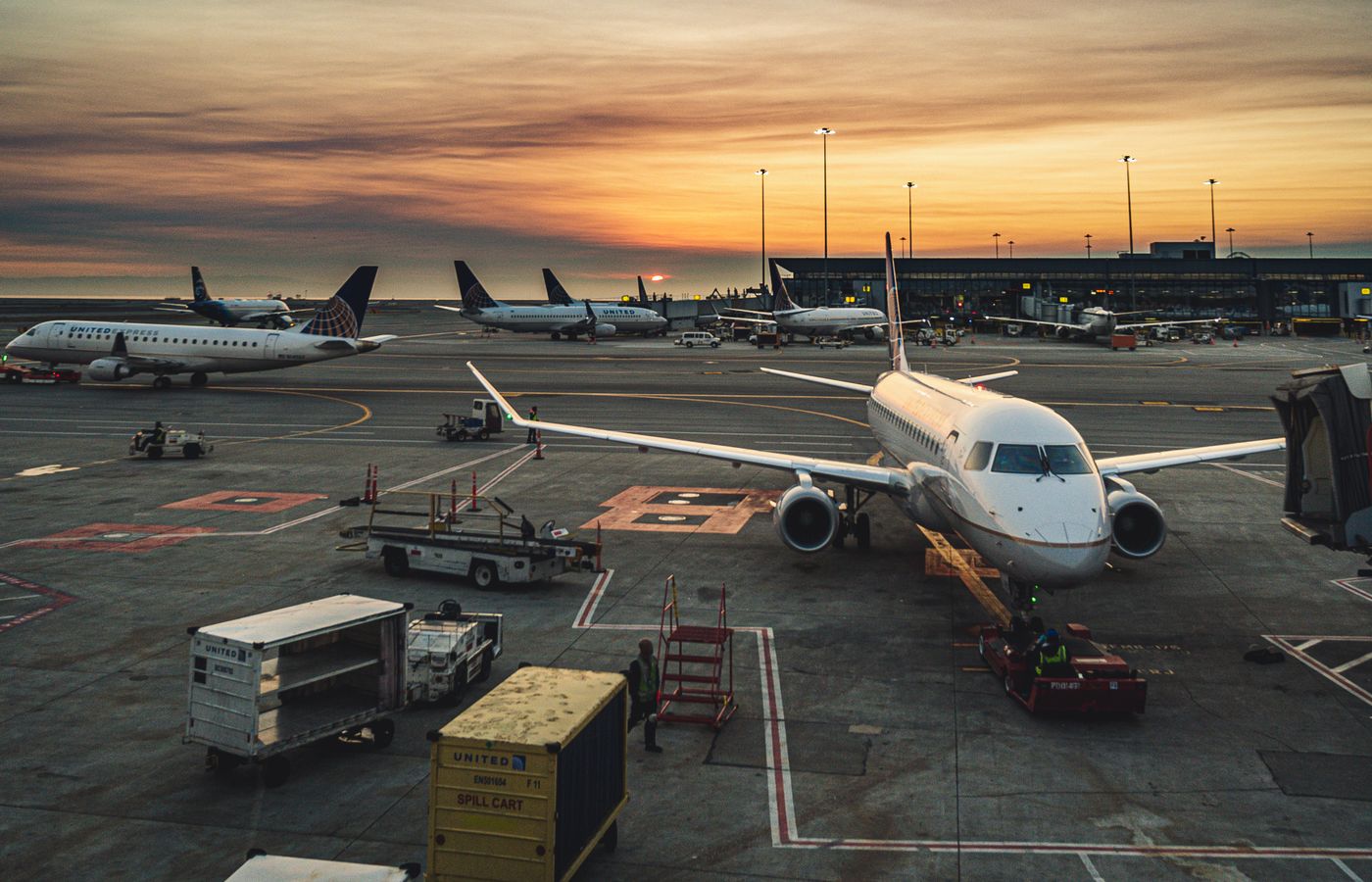 Airport departure gate at sunset