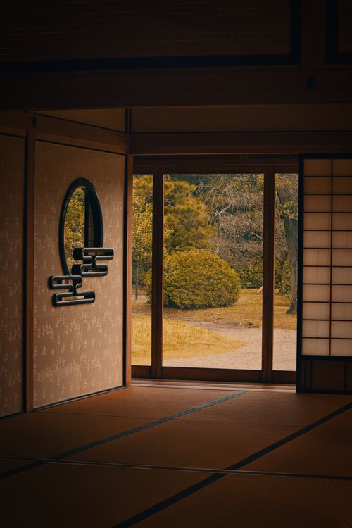 Free Peaceful interior of a Japanese room with view of garden outside, reflecting traditional Zen aesthetics. Stock Photo