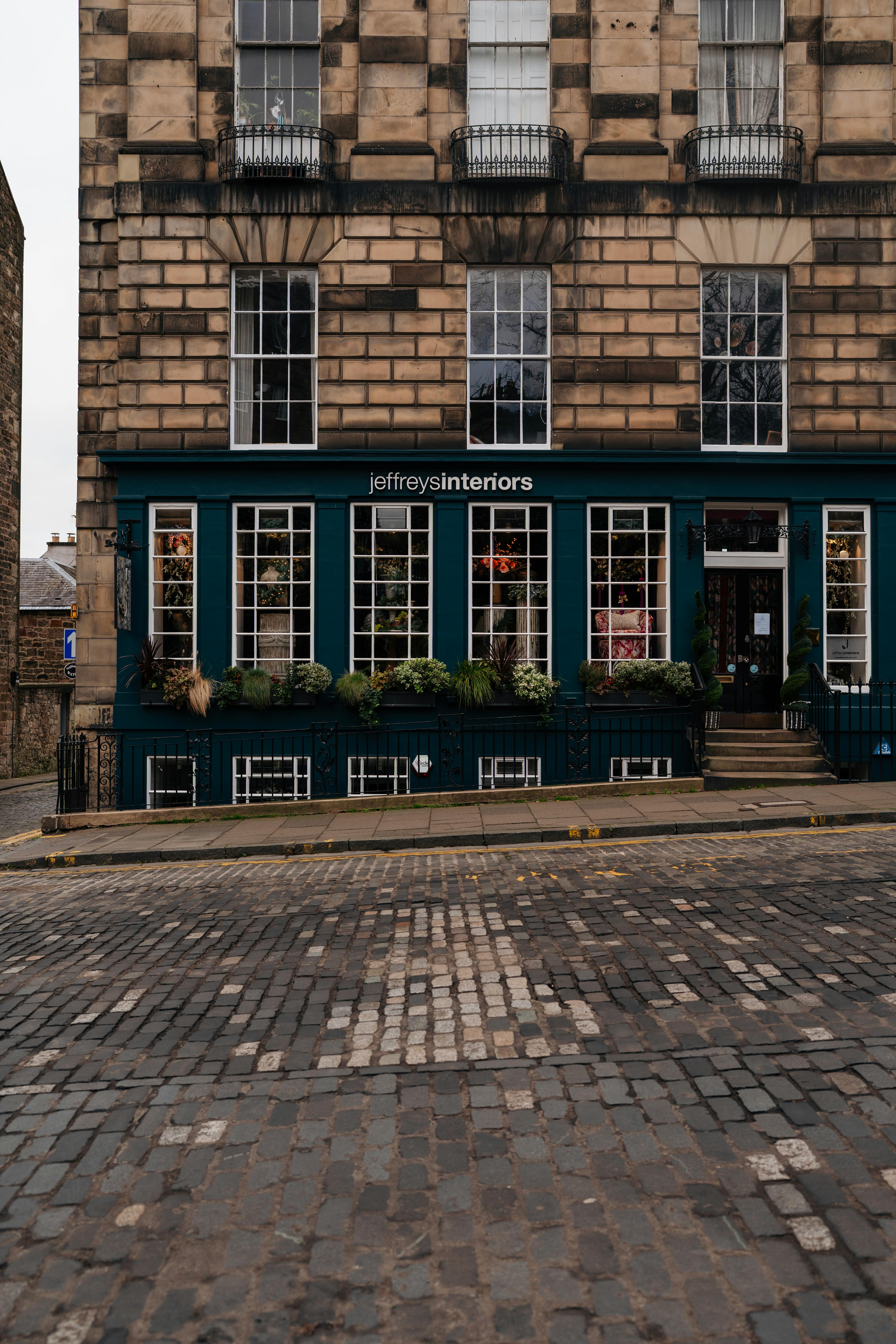 Charming street view of a Georgian building in Edinburgh, showcasing classic architectural details.
