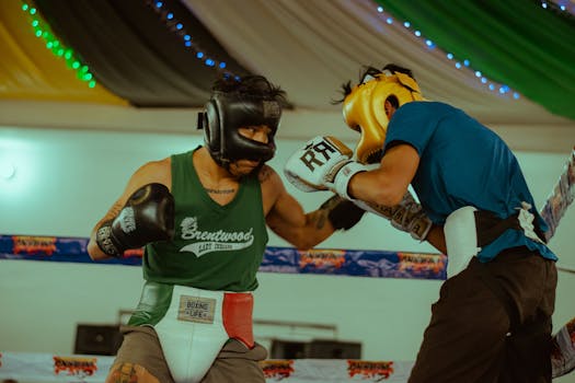 Intense boxing match between two athletes in a well-lit indoor arena with vibrant energy.