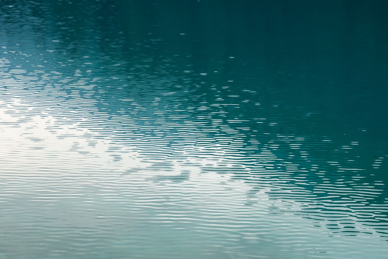 calm and tranquil water ripples captured in jiuzhaigou valley showcasi
