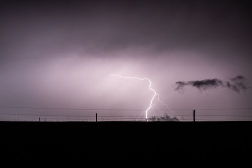 Free Dramatic lightning bolt over a field in Ephangweni, KwaZulu-Natal, South Africa. Stock Photo