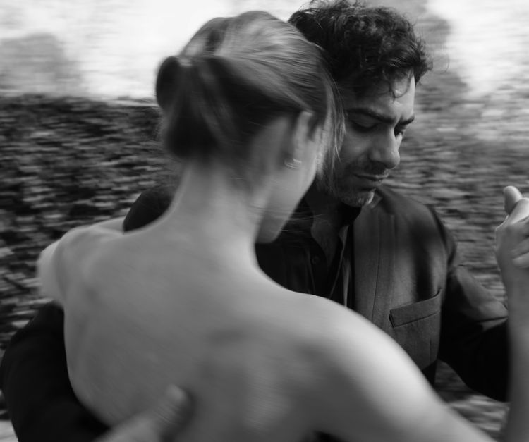 Couple in an abrazo during a milonga