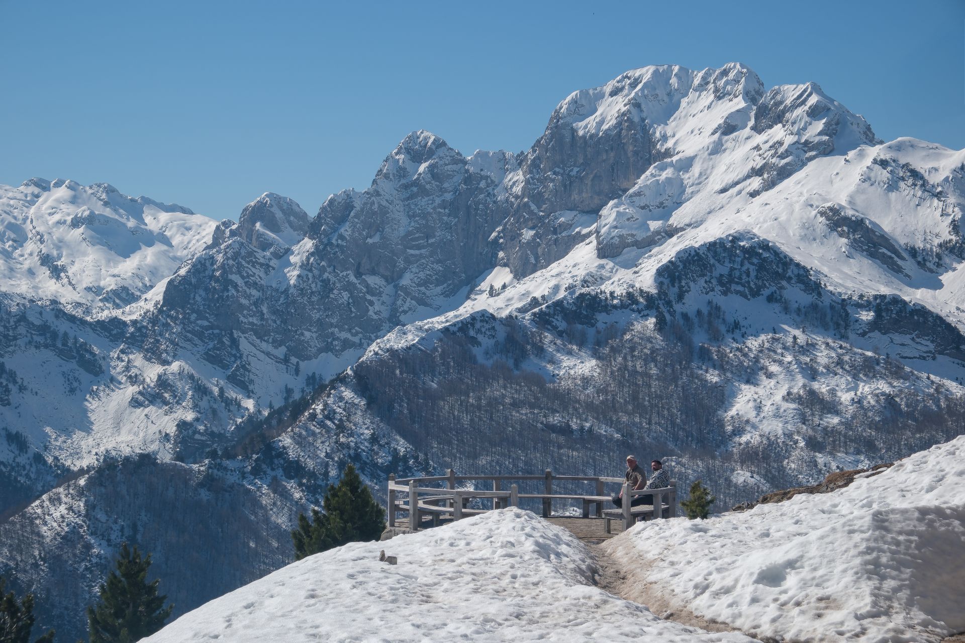 Breathtaking winter landscape of the Albanian Alps with snow-covered peaks.